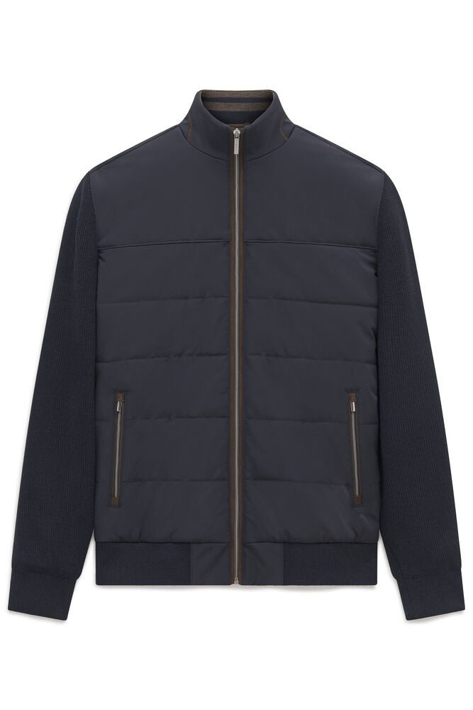 Navy blue men's hybrid full-zip cardigan with a padded body, knit sleeves, stand-up collar, and two front zip pockets.