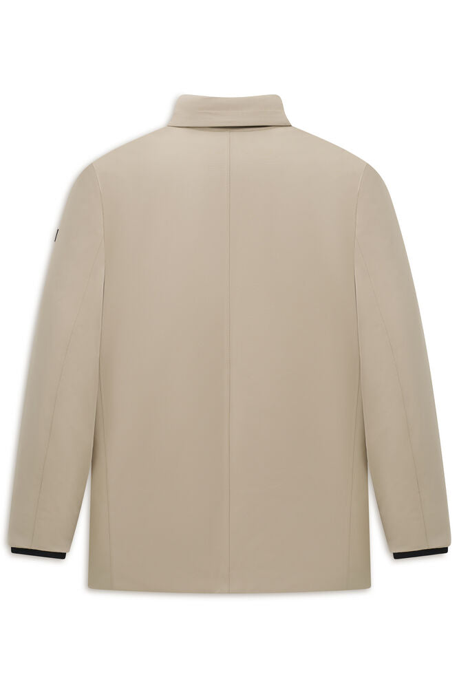 Beige jacket, back view. Features a collar, long sleeves with dark cuffs, and a vertical back seam. Smooth fabric.