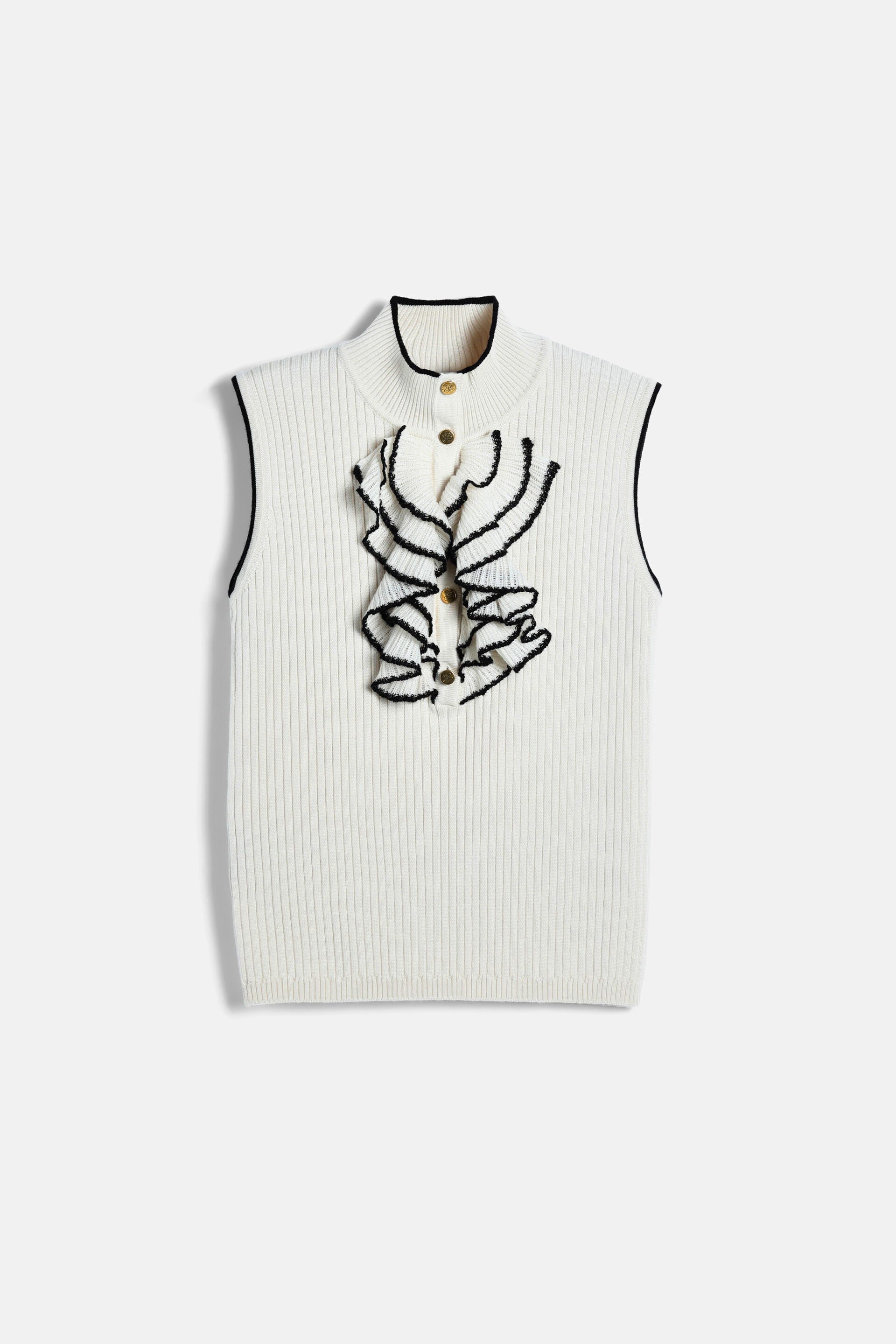 Cream ribbed knit sleeveless pullover with a mock neck and black trim. Features a black ruffled placket with gold-toned butto