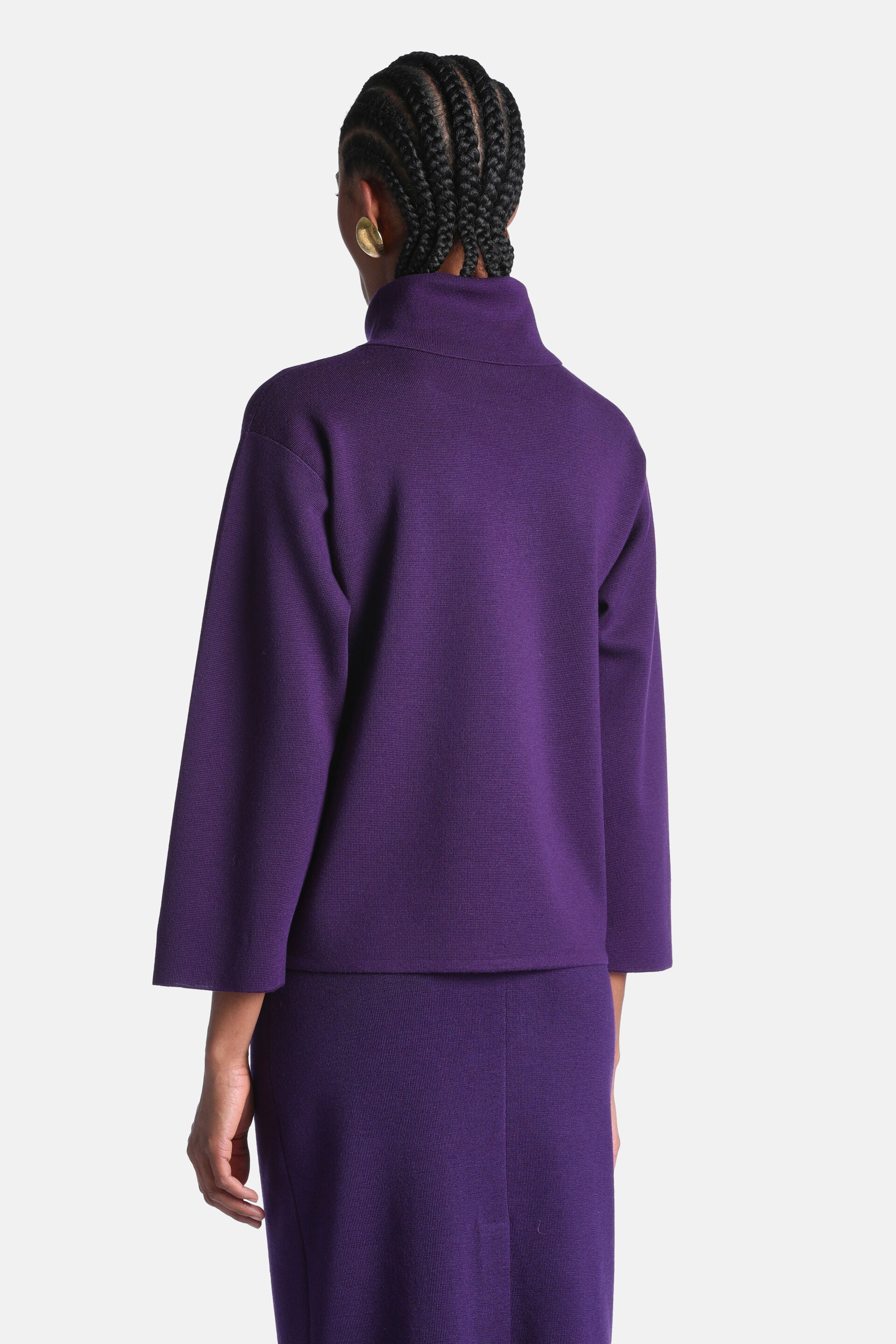 Deep purple knit tunic with a mock turtleneck and wide 3/4 length sleeves.