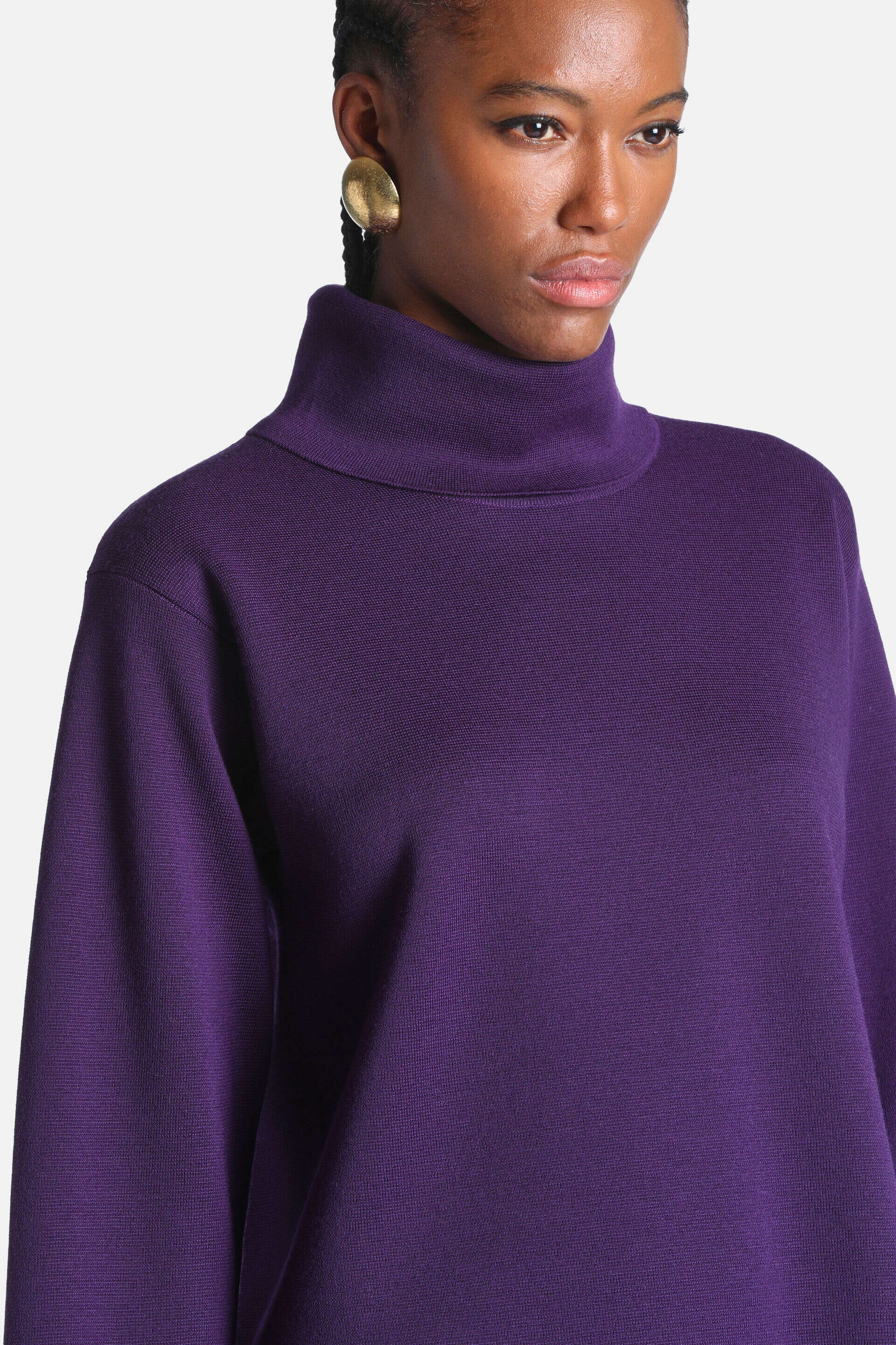 Deep purple knit tunic with a high turtleneck and long sleeves.