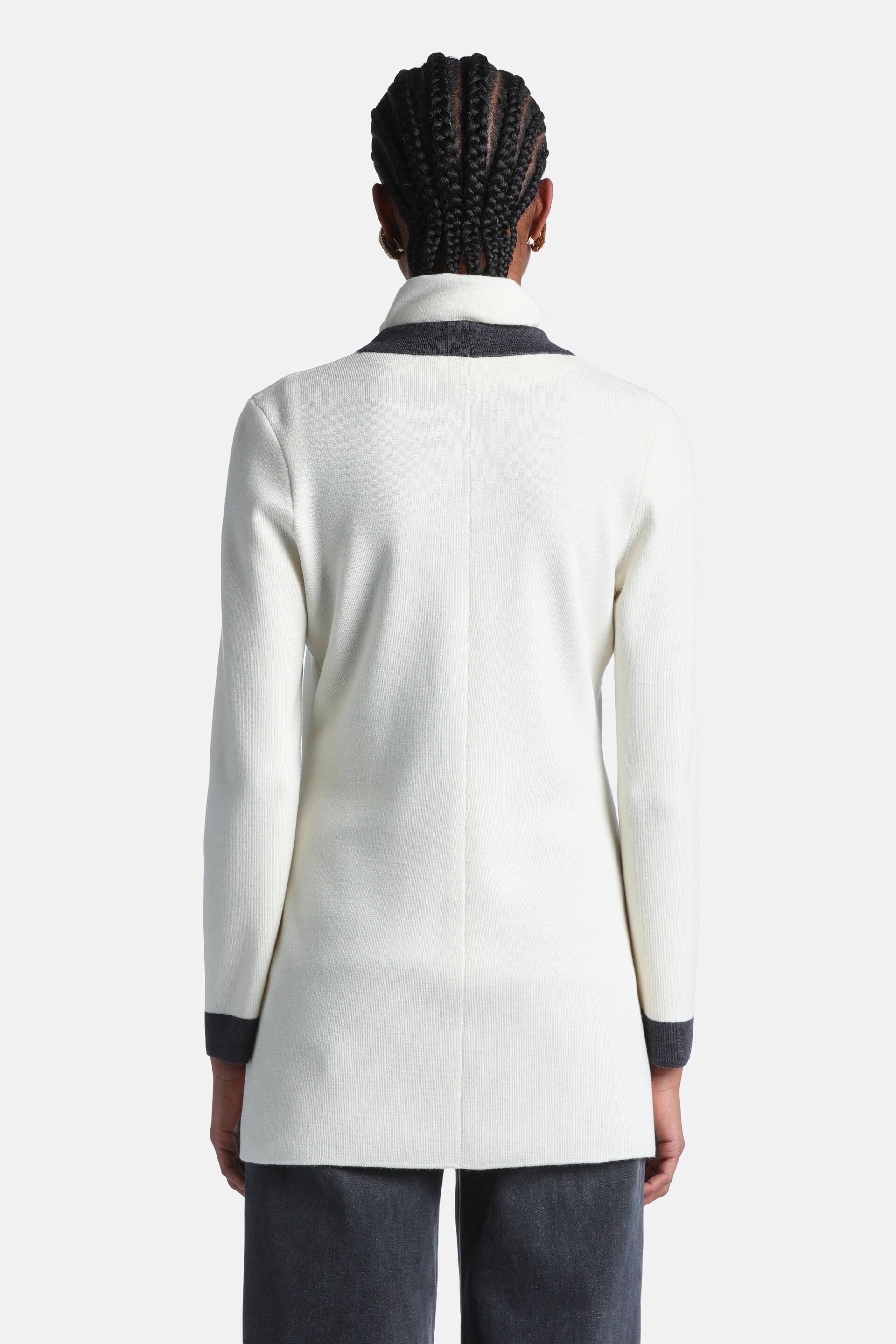 Back view of an off-white cardigan with long sleeves, a dark grey stand-up collar, and dark grey cuffs.