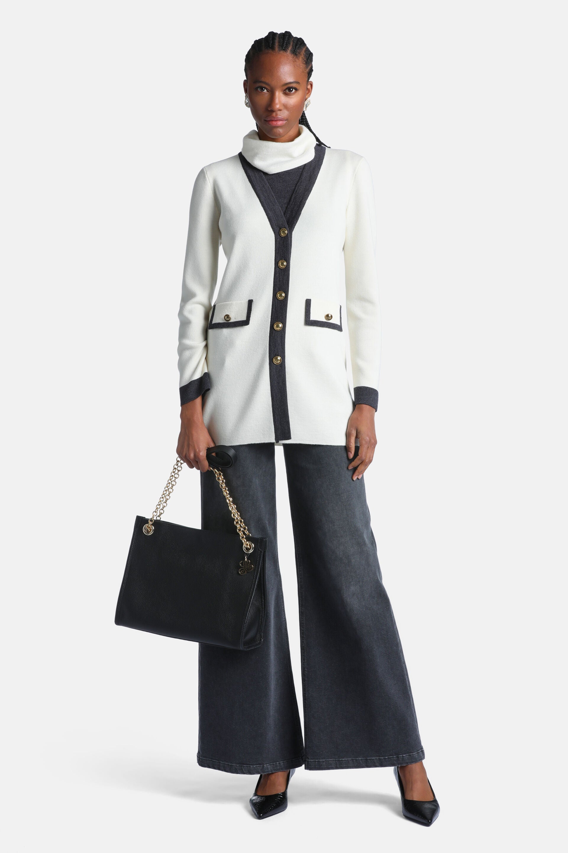 Off-white long-sleeved cardigan with dark grey trim on V-neck, front, cuffs, and two patch pockets. Features five gold-toned