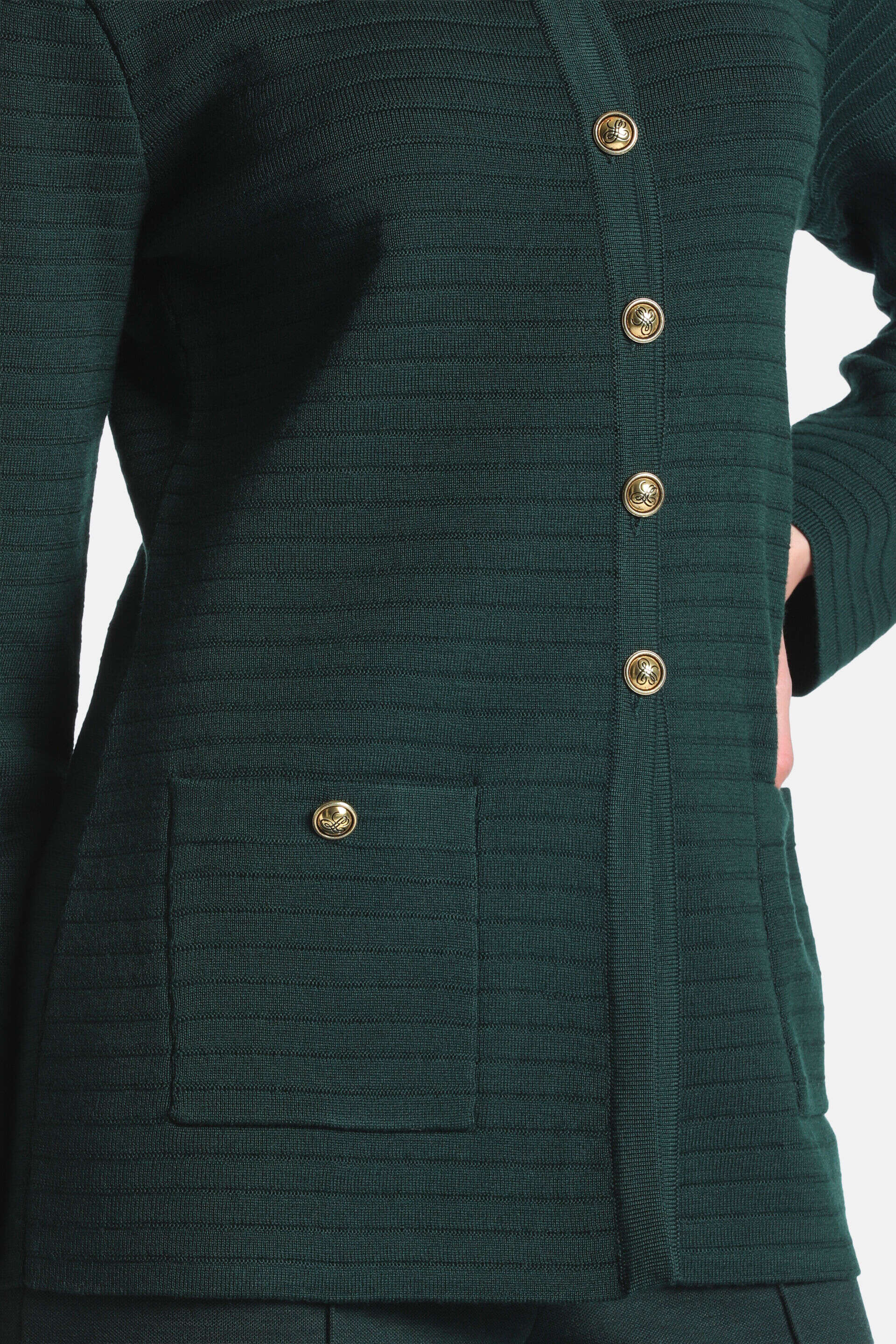 Dark green ribbed knit cardigan with gold-toned decorative buttons down the front and on a single patch pocket.