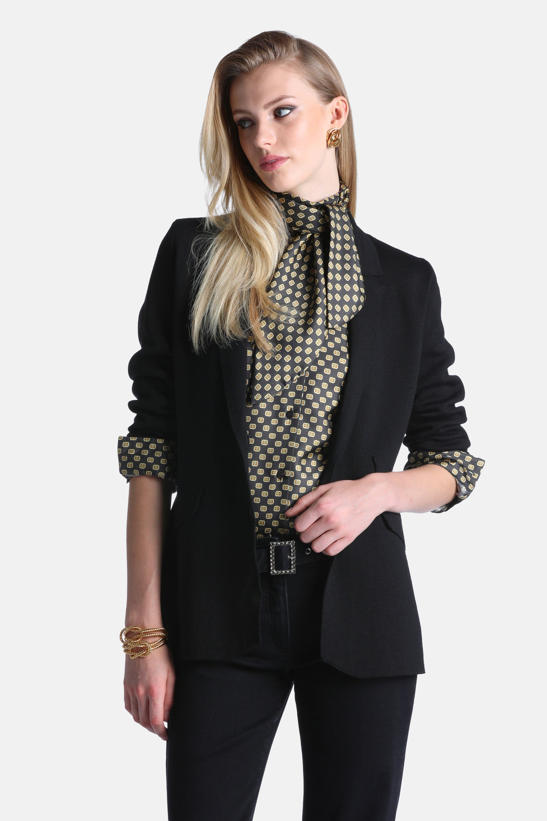 Black tailored blazer jacket with notched lapels and long sleeves, featuring a smooth fabric and a slightly rounded front hem