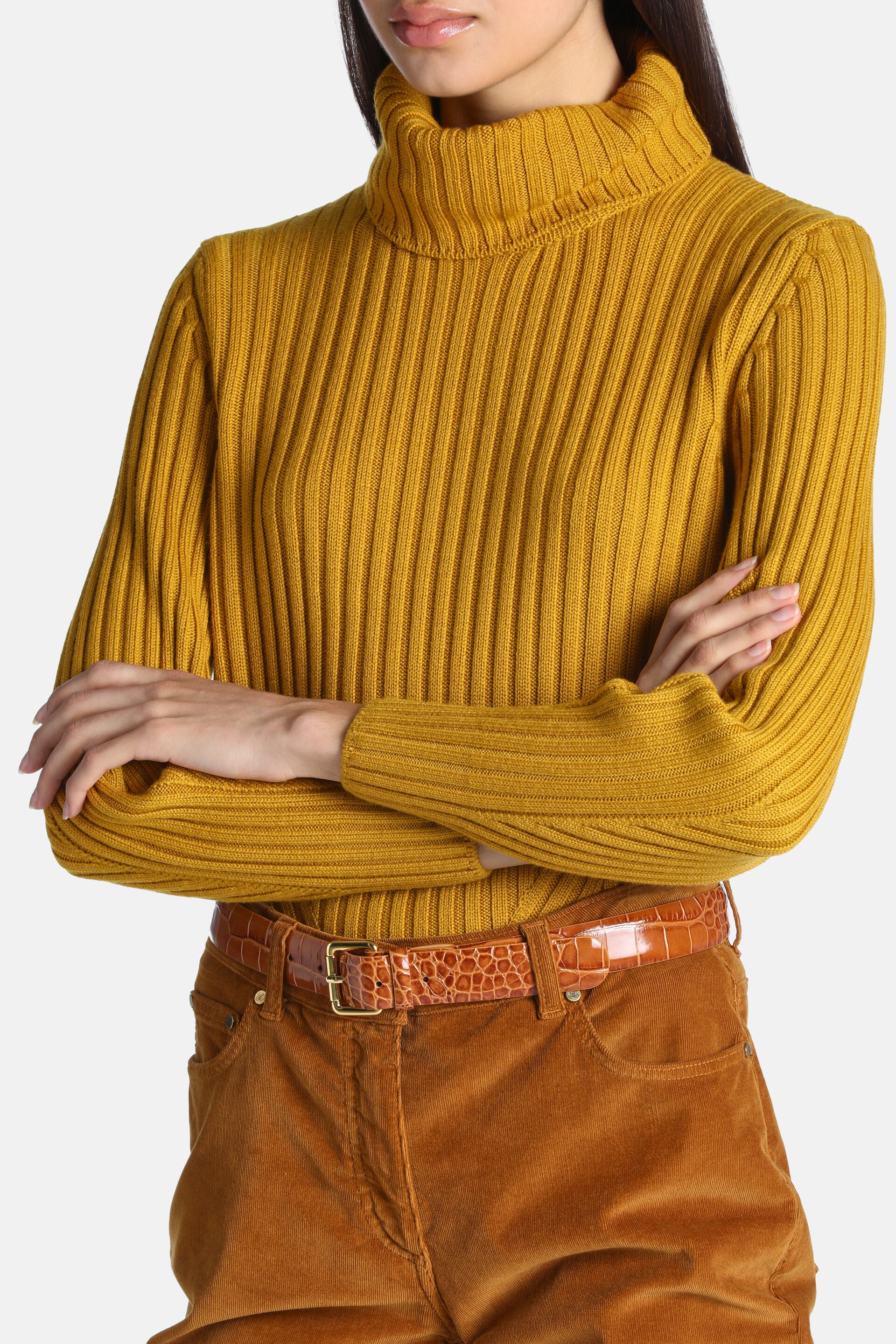 Mustard ribbed knit turtleneck pullover with long sleeves and ribbed cuffs.