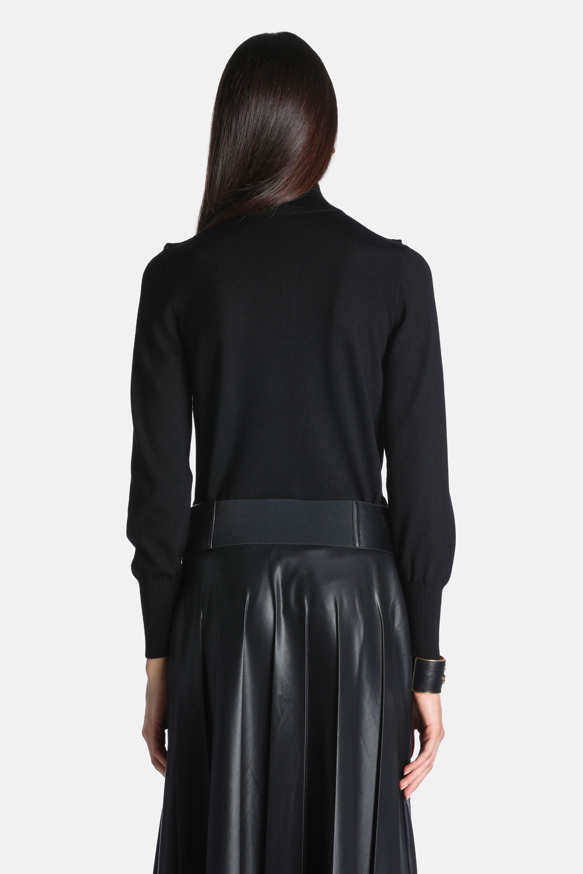 Black fine-knit pullover with a mock neck, long sleeves with ribbed cuffs, and subtle shoulder tabs.