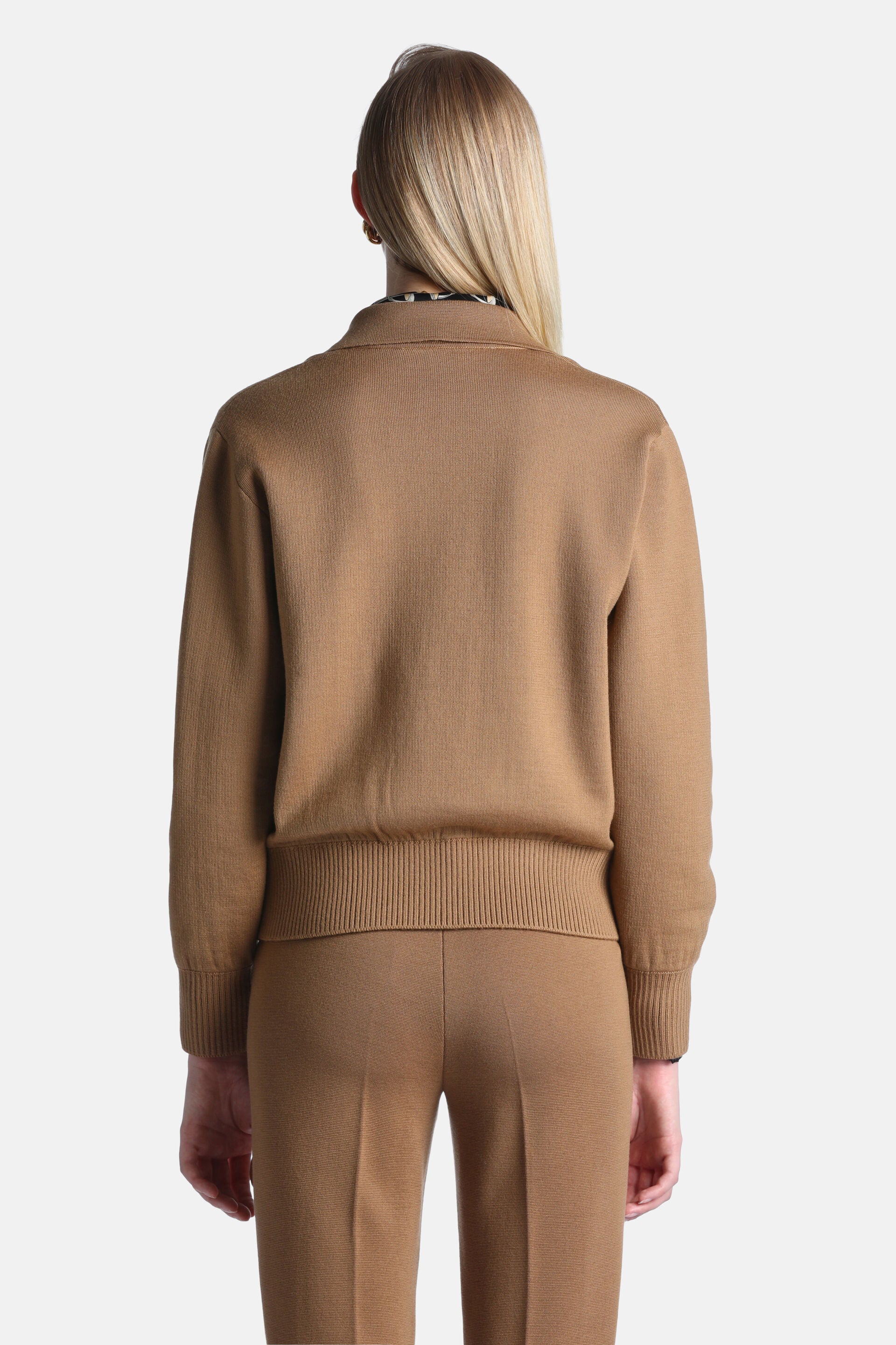 Camel knit jacket with a collar, long sleeves with ribbed cuffs, and a ribbed hem, viewed from the back.