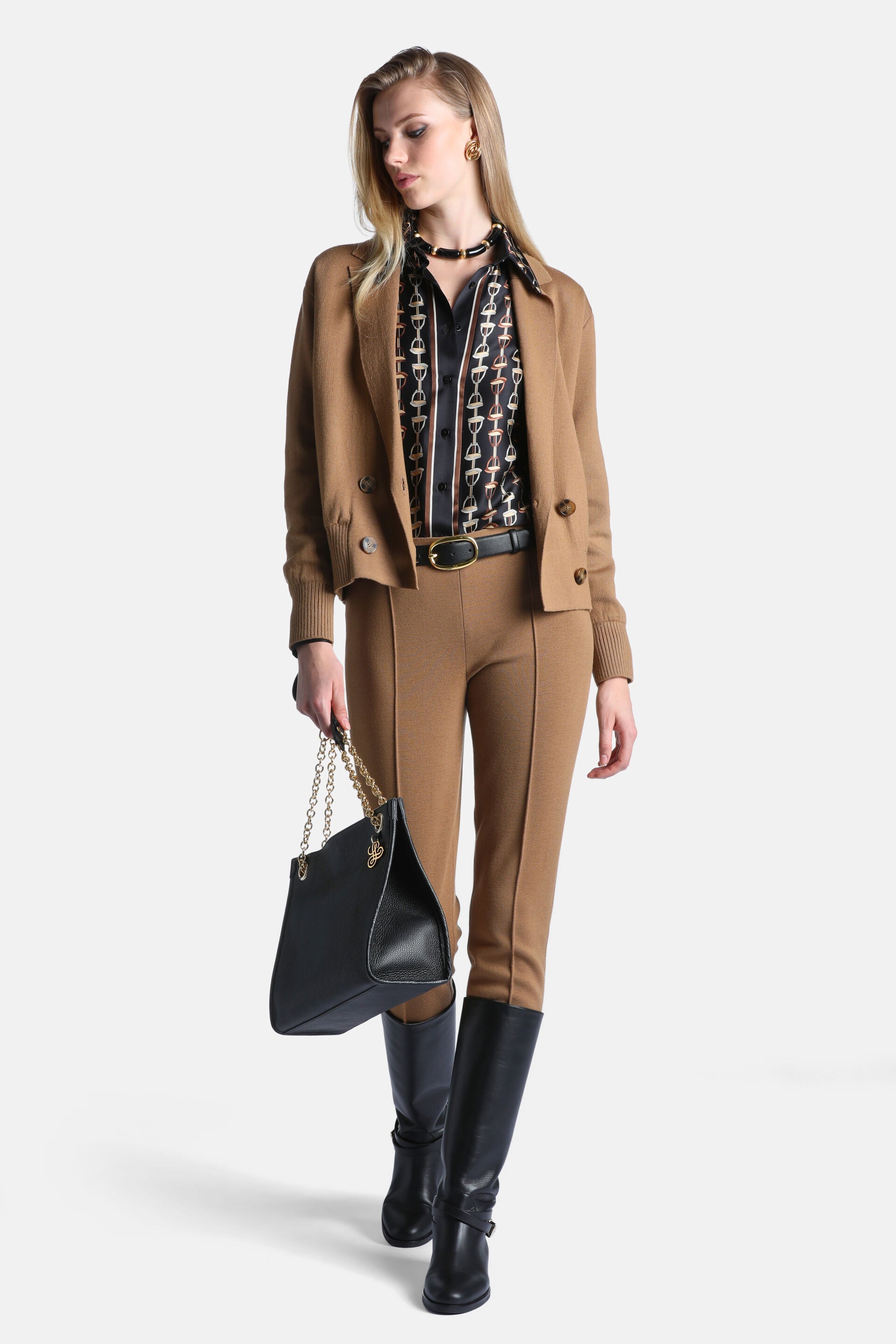 Camel knit double-breasted jacket with notched lapels, brown buttons, two front patch pockets, and ribbed cuffs and hem.