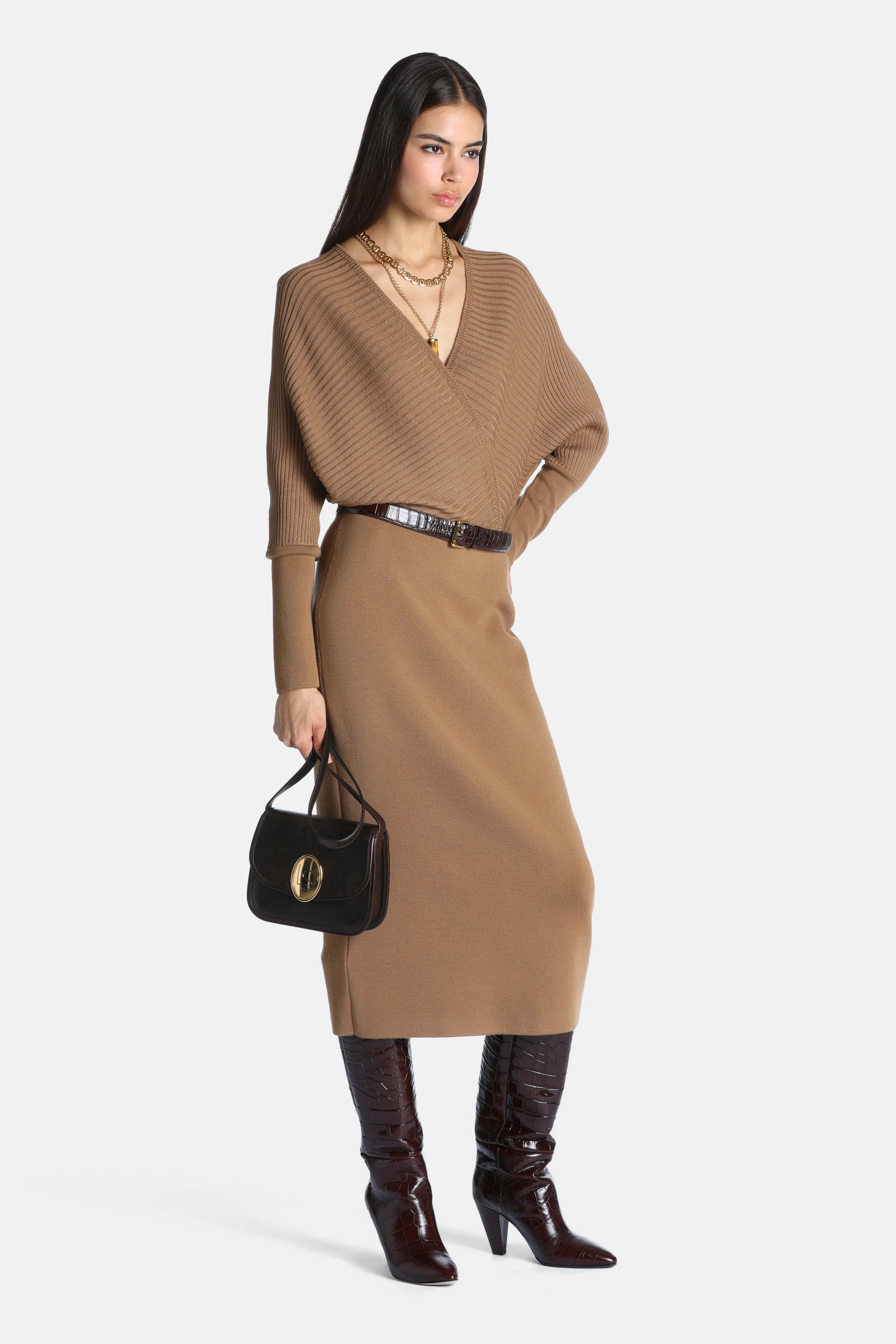 Camel ribbed knit midi dress with a wrap-style V-neck, dolman sleeves, ribbed cuffs, and a smooth knit fitted skirt.