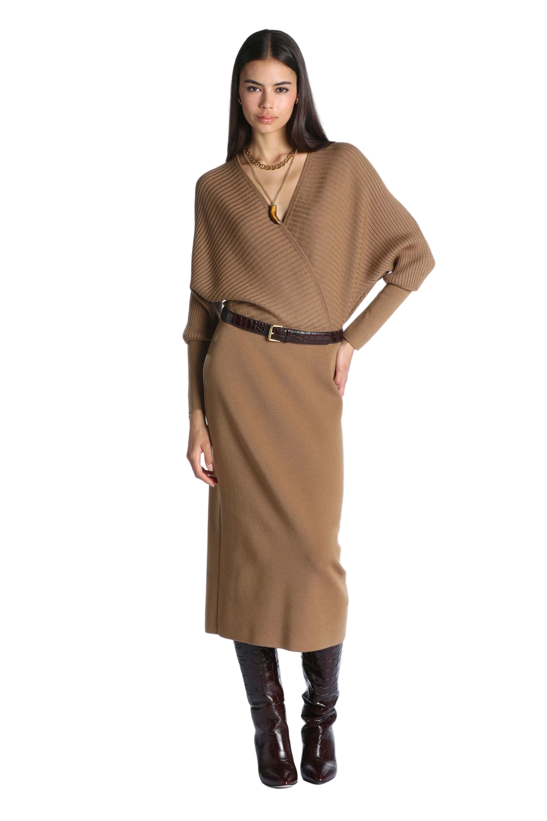 Brown knit midi dress with a wrap-style V-neck bodice, ribbed texture, and dolman sleeves with fitted cuffs.