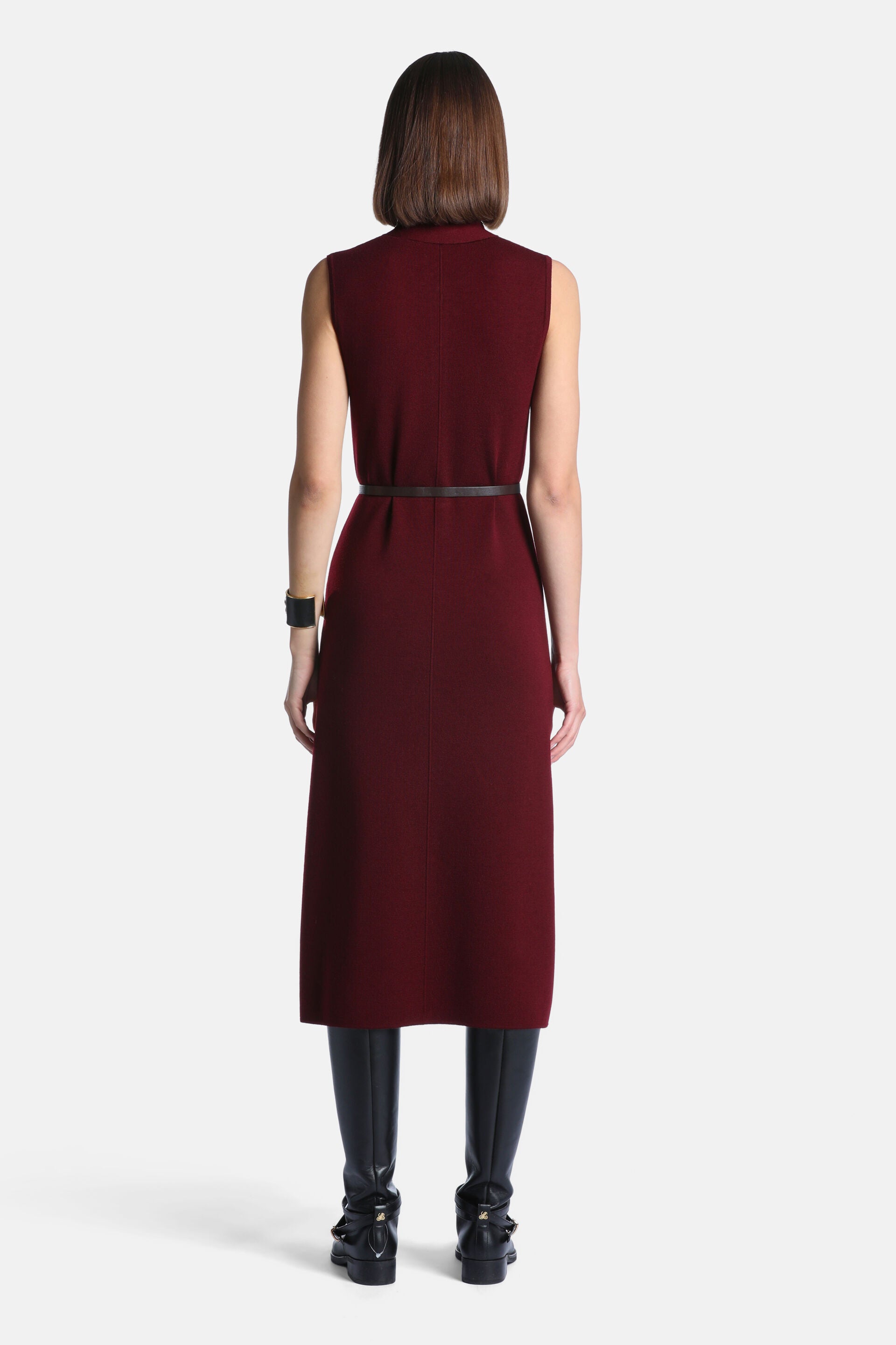 Burgundy sleeveless midi dress with a mock neck, thin dark brown belt at the waist, and a center back seam.