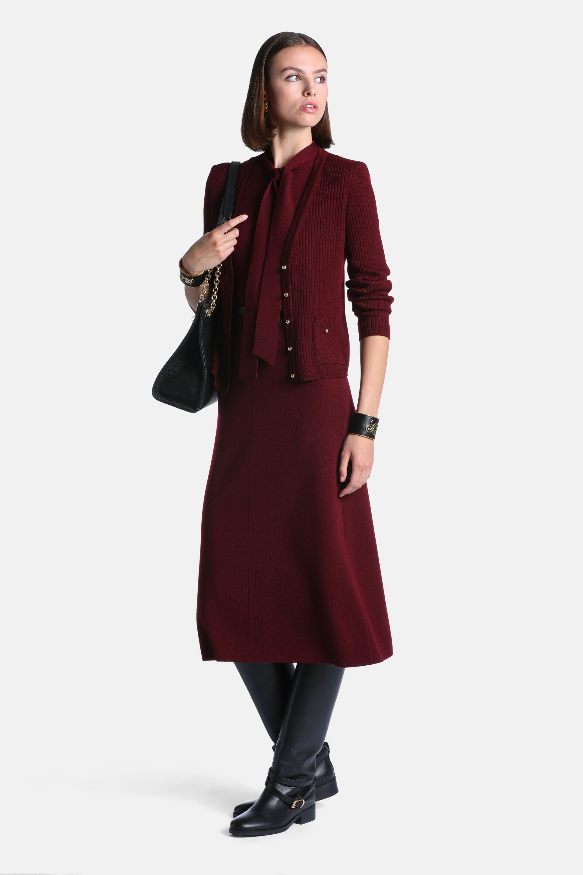 Burgundy midi dress with a pussy-bow neckline and long sleeves. The skirt has a smooth A-line silhouette.