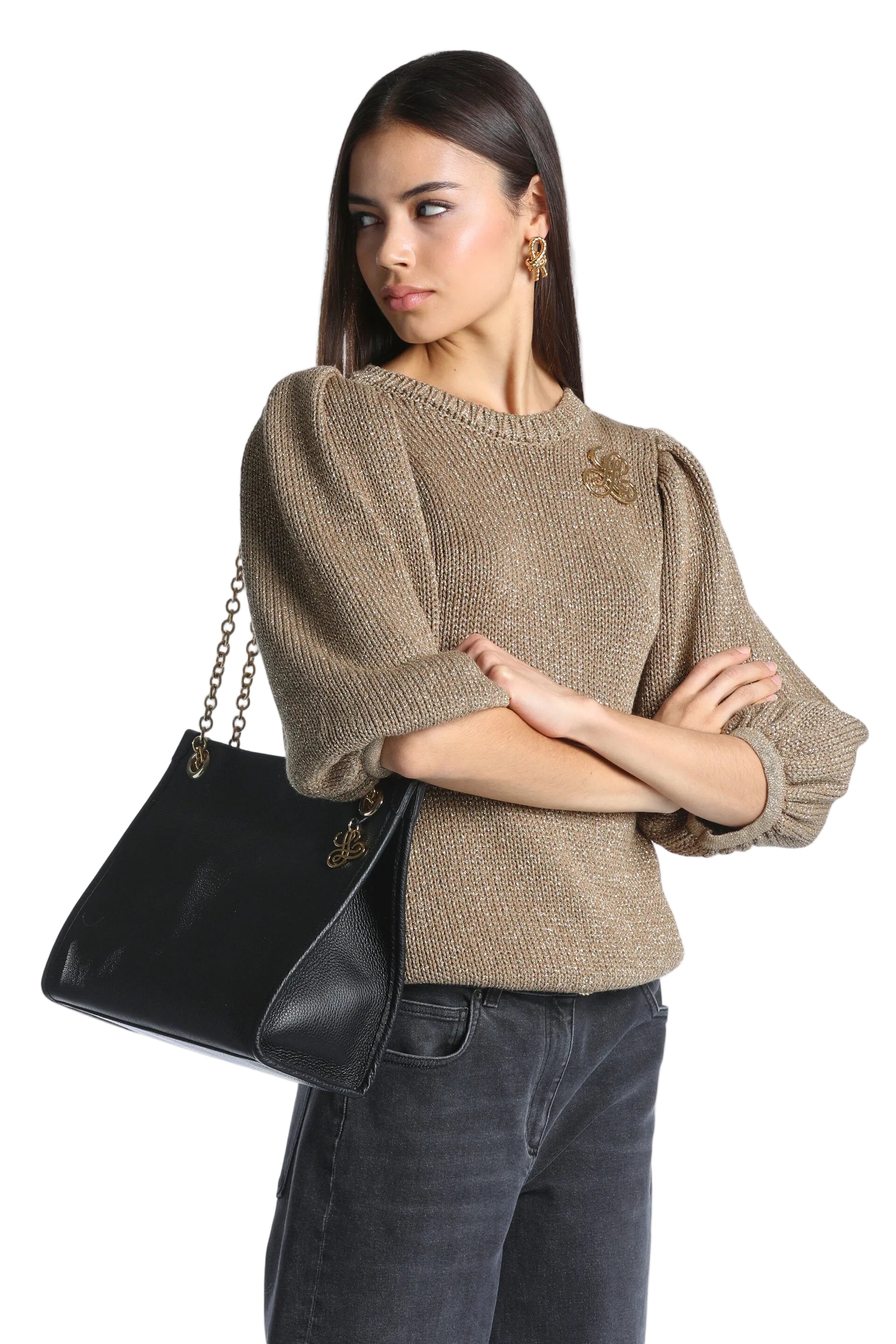 Gold-toned knit pullover with puff sleeves, ribbed cuffs and hem, and a decorative floral-like embellishment on the chest.