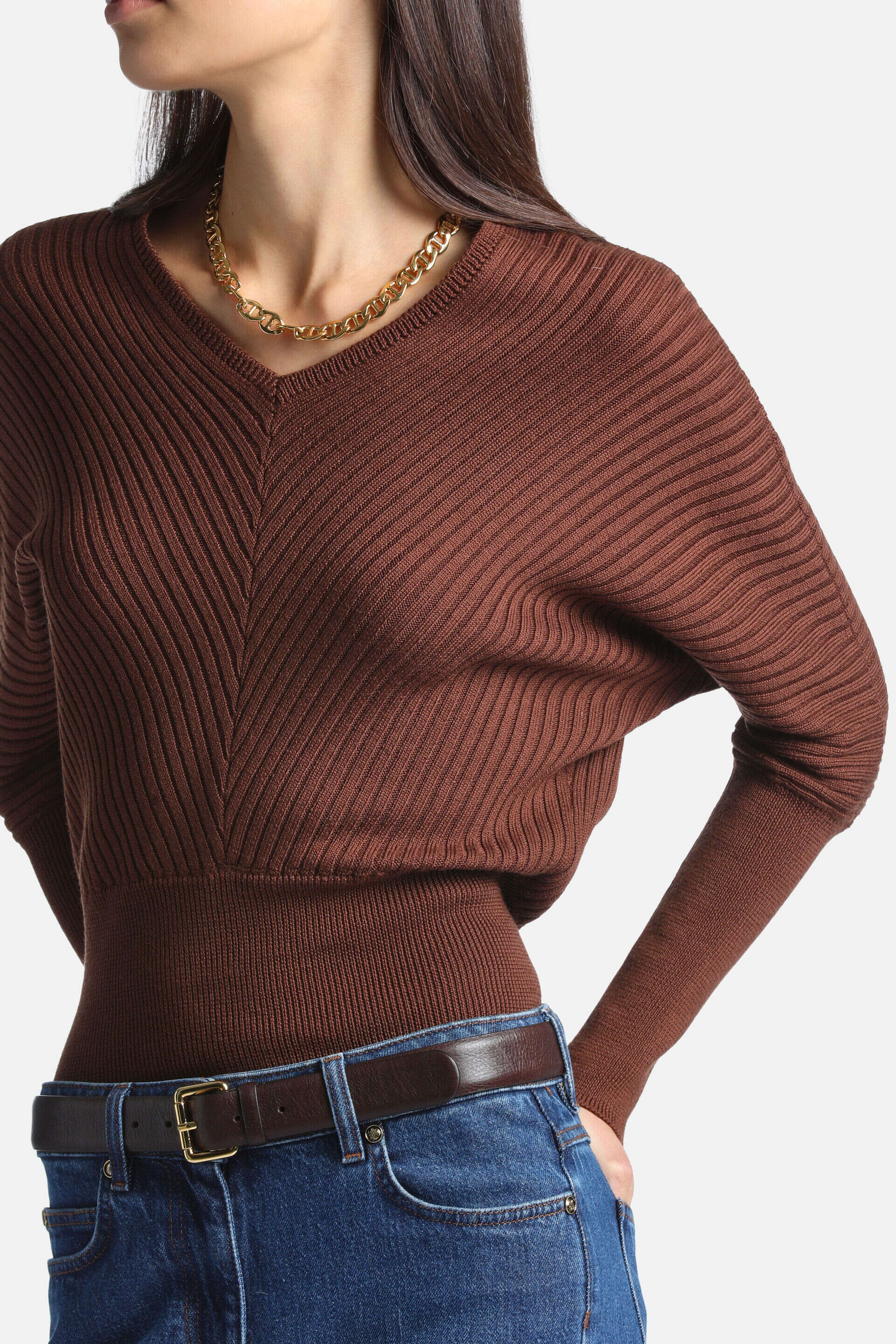 Tobacco brown ribbed knit pullover with a V-neck, V-shaped ribbing pattern on the front, and fitted cuffs and hem.