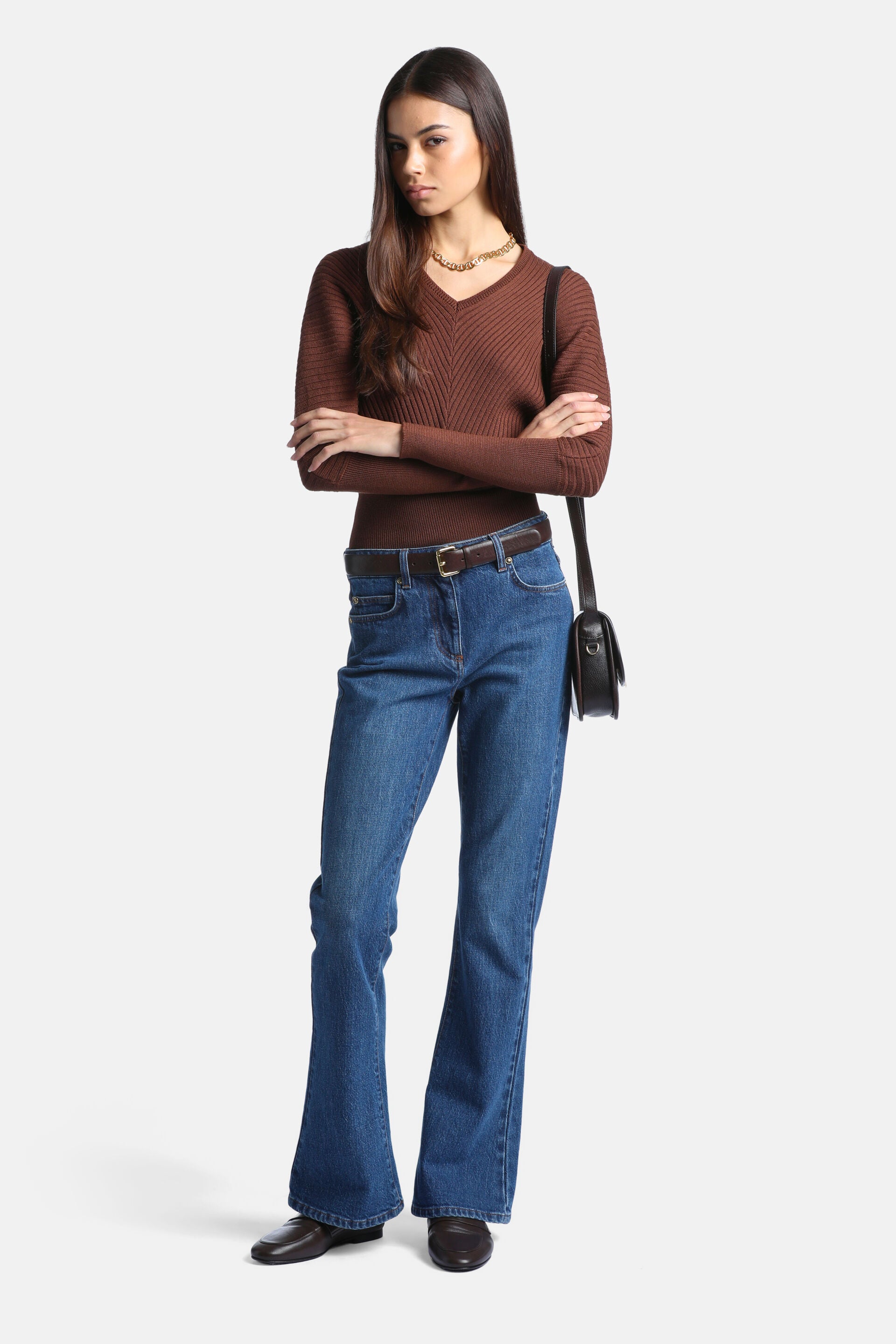 Tobacco brown ribbed knit pullover sweater with a V-neck, diagonal ribs on the chest, and vertical ribs on the sleeves.