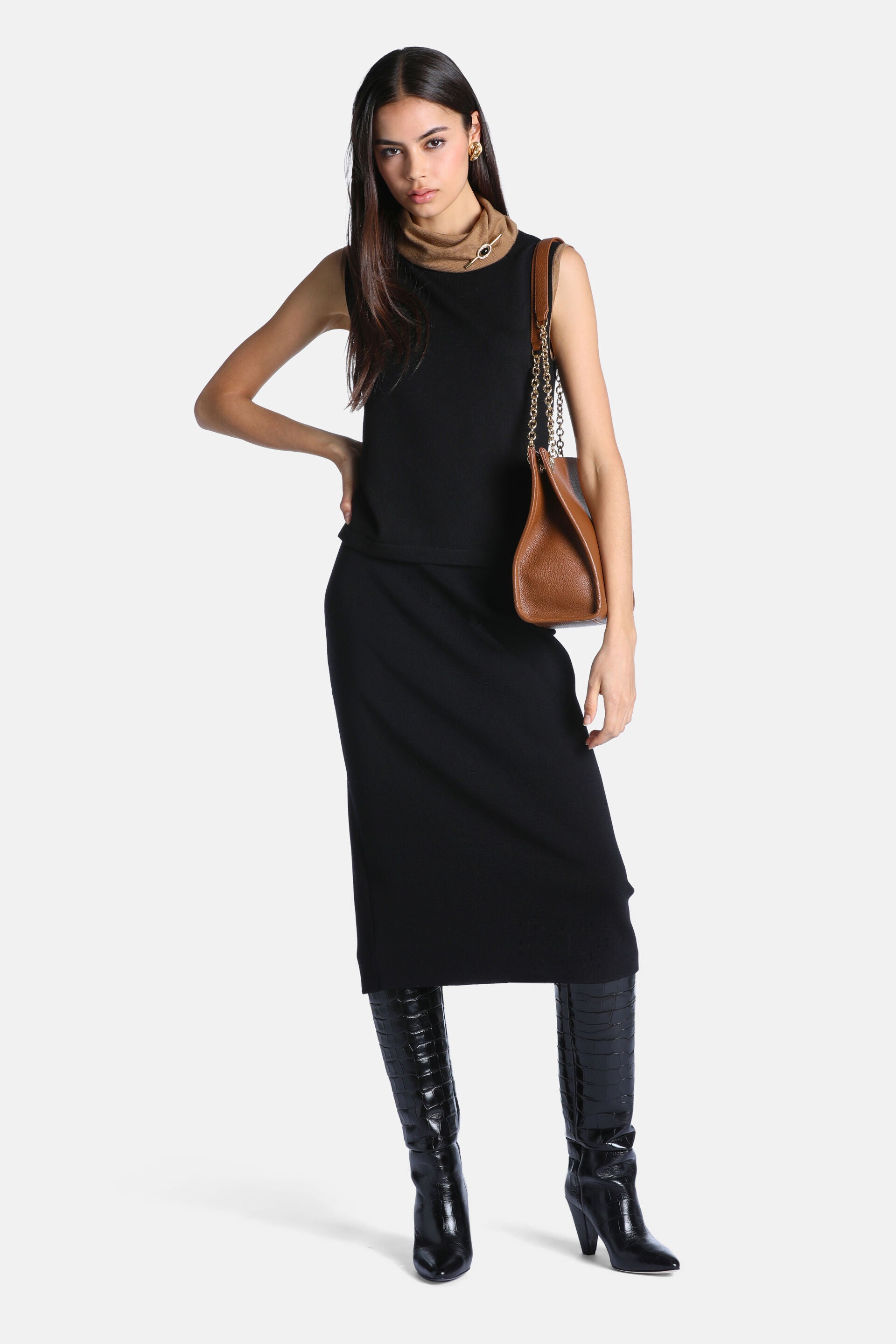 Black fine knit sleeveless sweater with a high crew neck and a straight hem.