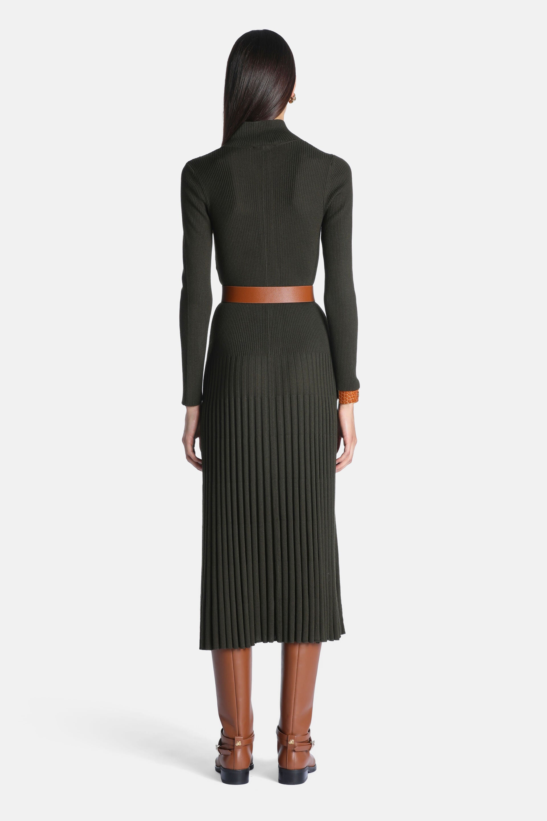 Dark green ribbed knit turtleneck dress with long sleeves and a pleated midi skirt.