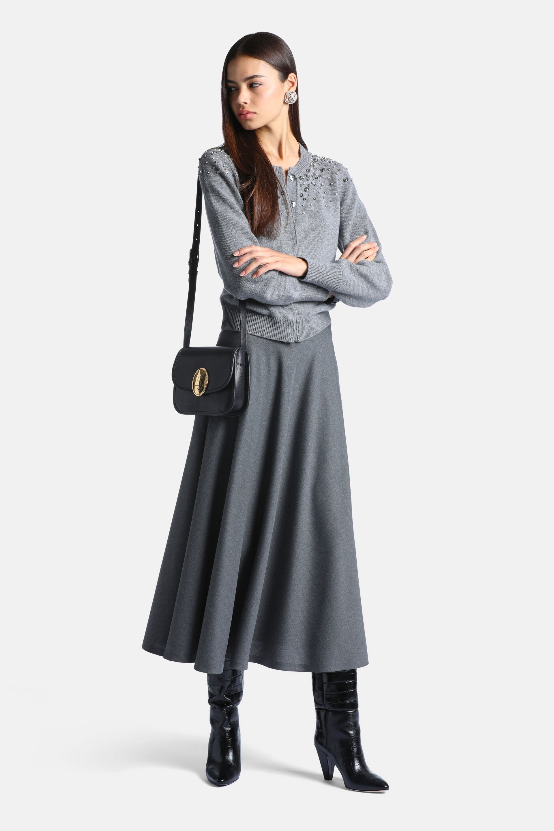 Grey knit cardigan with a round neck, silver-toned buttons, and scattered silver-toned bead embellishments on the shoulders a