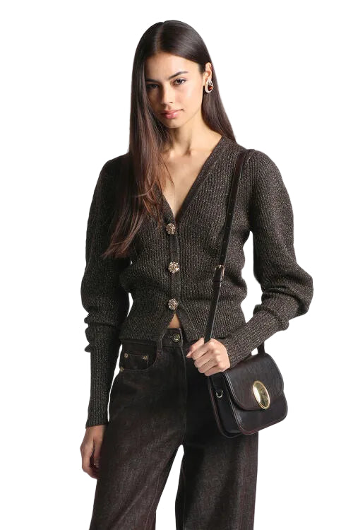 Brown gold knit cardigan with V-neck, puff shoulders, ribbed cuffs, and jewelled buttons.