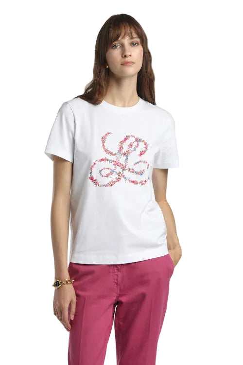 Off-white short-sleeved T-shirt with a crew neck and a large pink and blue floral 'L' motif on the front.