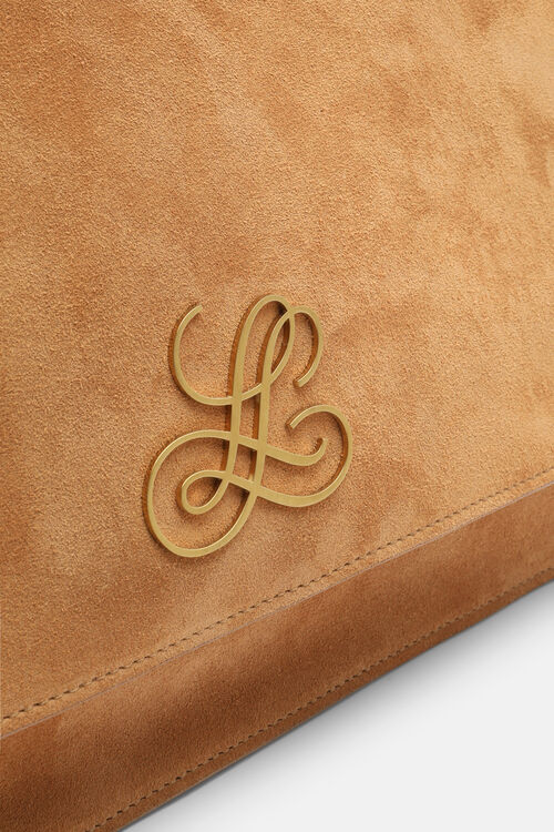 Caramel suede bag with a flap closure, featuring an ornate gold-toned 'L' logo and visible stitching along the flap edge.