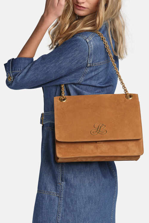 Caramel suede-like shoulder bag with a flap closure, gold-toned chain strap, and an "L" monogram on the flap.
