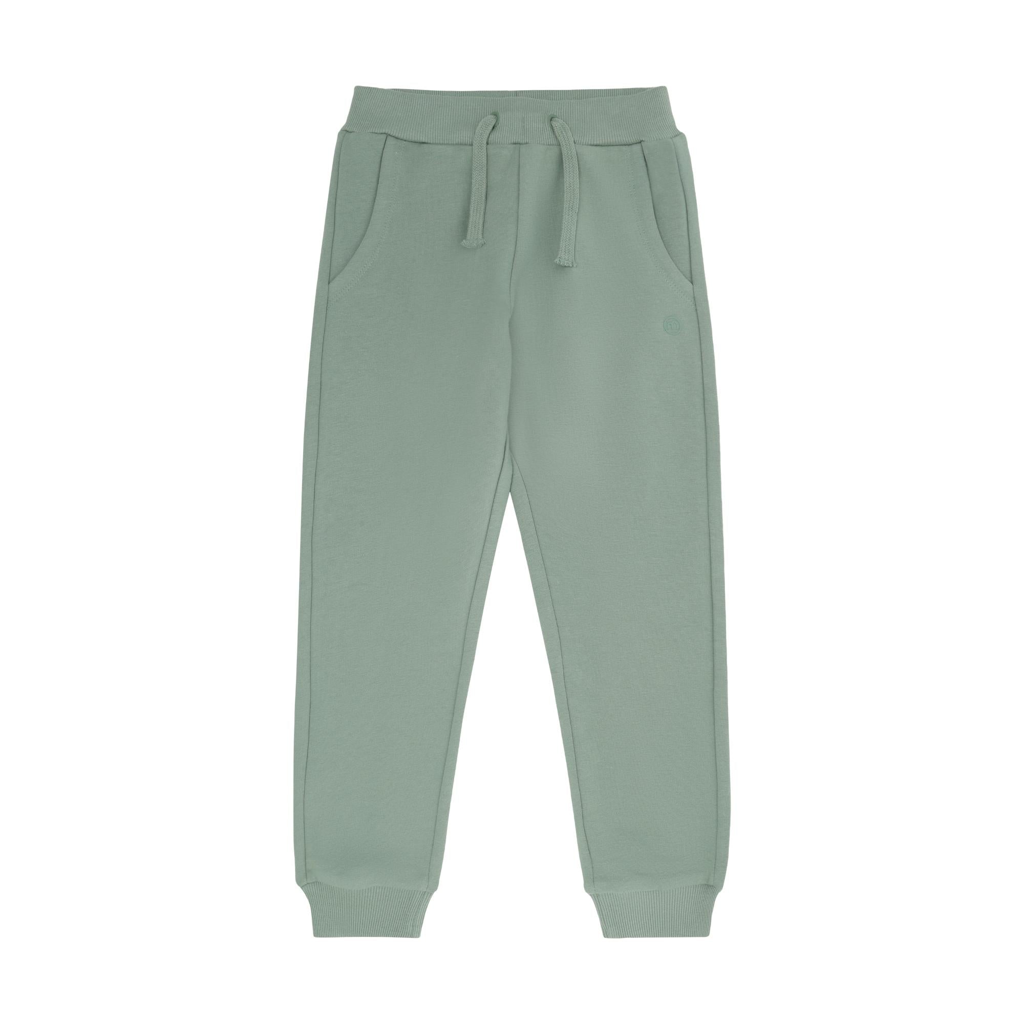 Light green sweatpants with a ribbed drawstring waistband, side pockets, a small embroidered logo on the right thigh, and rib