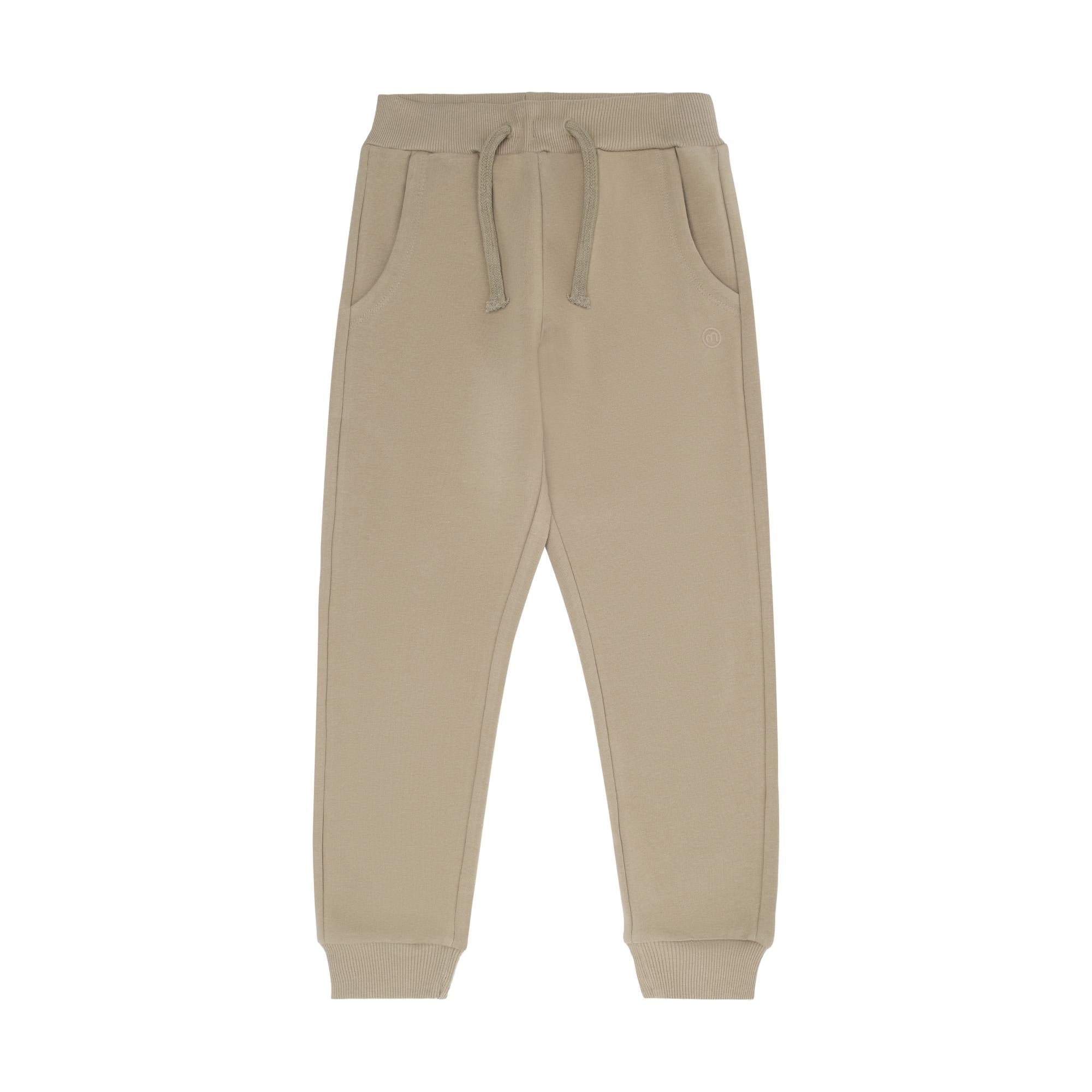 Beige sweatpants with an elastic ribbed waistband, drawstring, side pockets, and ribbed ankle cuffs. Small embroidered logo o