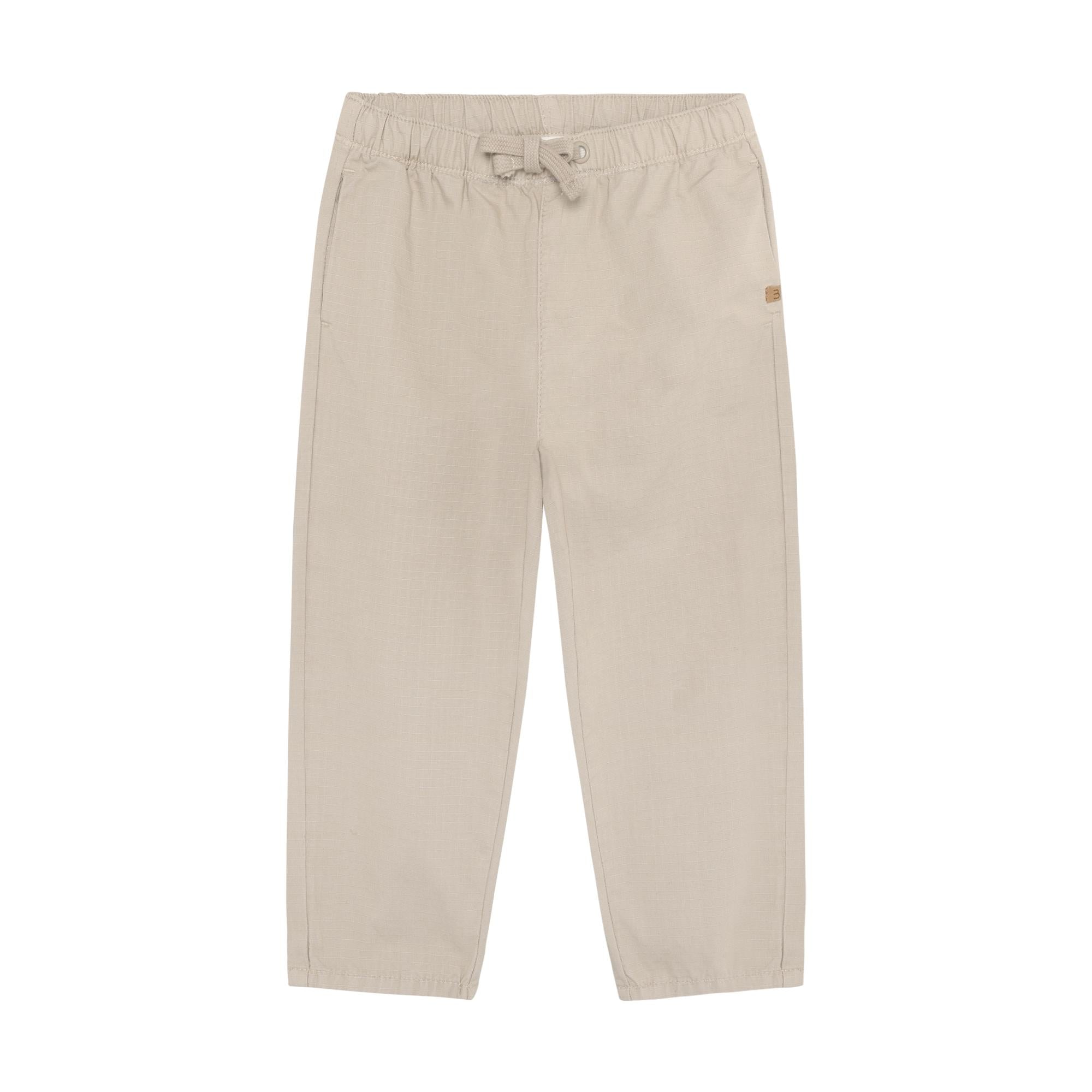 Light beige ripstop trousers for kids with an elasticated drawstring waist and side slash pockets.