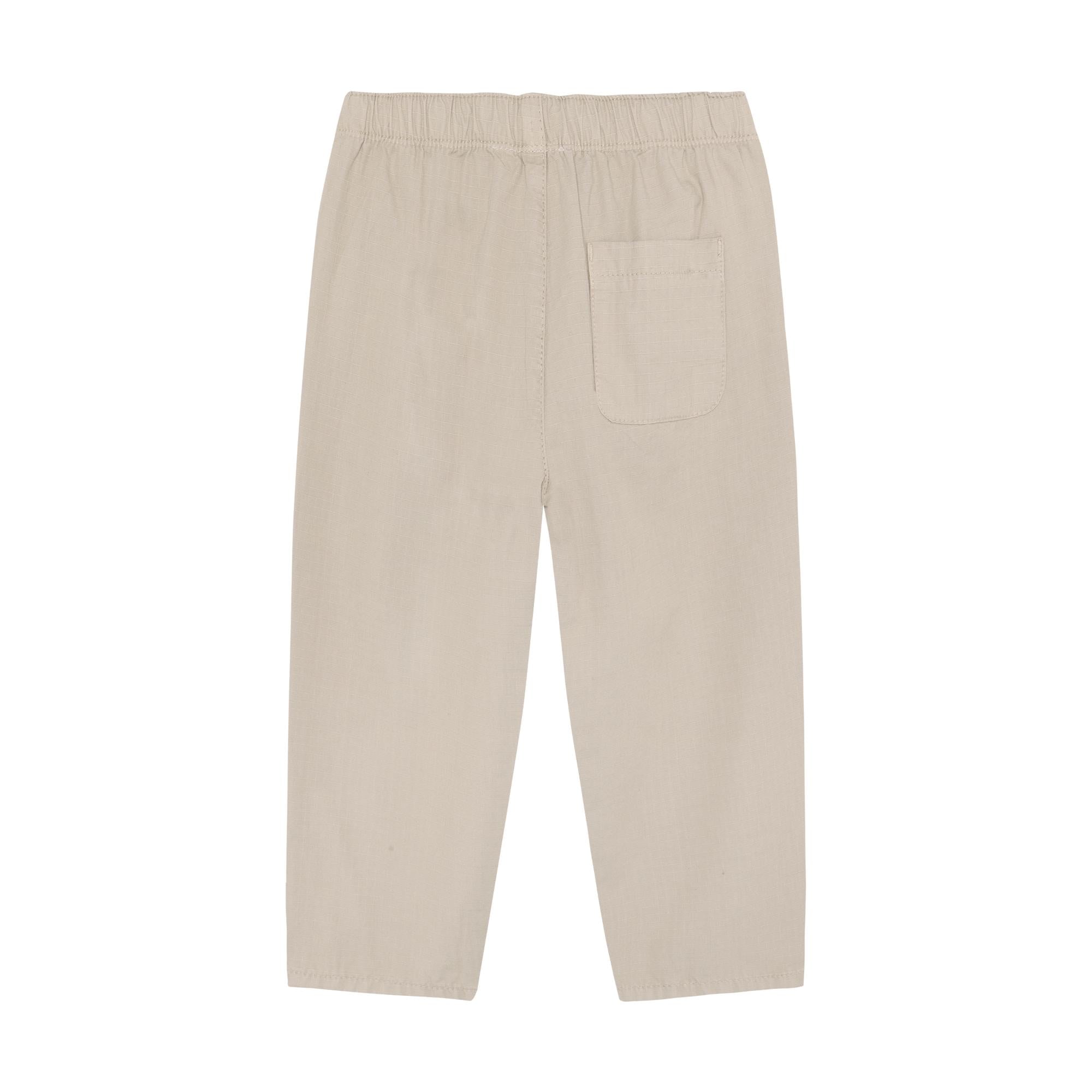 Light beige ripstop pants with an elasticated waist, one rear patch pocket, and straight, cropped legs.