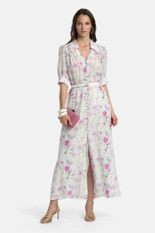 Off-white fuchsia floral maxi shirt dress with collared V-neck, short puffed sleeves, button front, white belt, and front sli