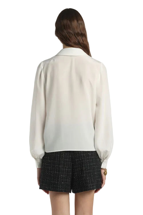Off-white Crêpe de Chine shirt, back view. Features a pointed collar, long puffed sleeves with gathered cuffs, and a straight