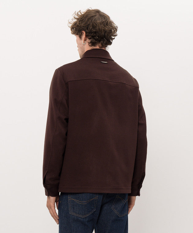 Dark burgundy red jacket with a shirt collar, back yoke, long sleeves, buttoned cuffs, and a straight hem.
