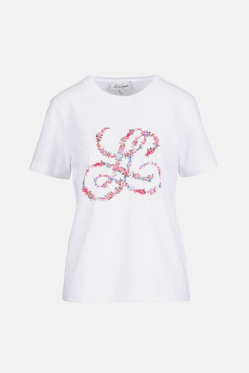 Off-white short-sleeve crew neck t-shirt with a large pink and blue floral intertwined initial design on the front.