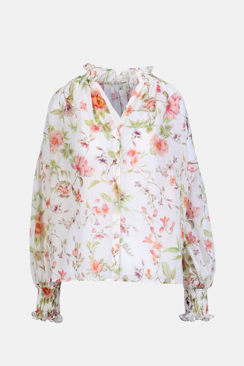 Off-white floral blouse with peach, pink, green flowers. Ruffled V-neck, button front, smocked ruffled cuffs.