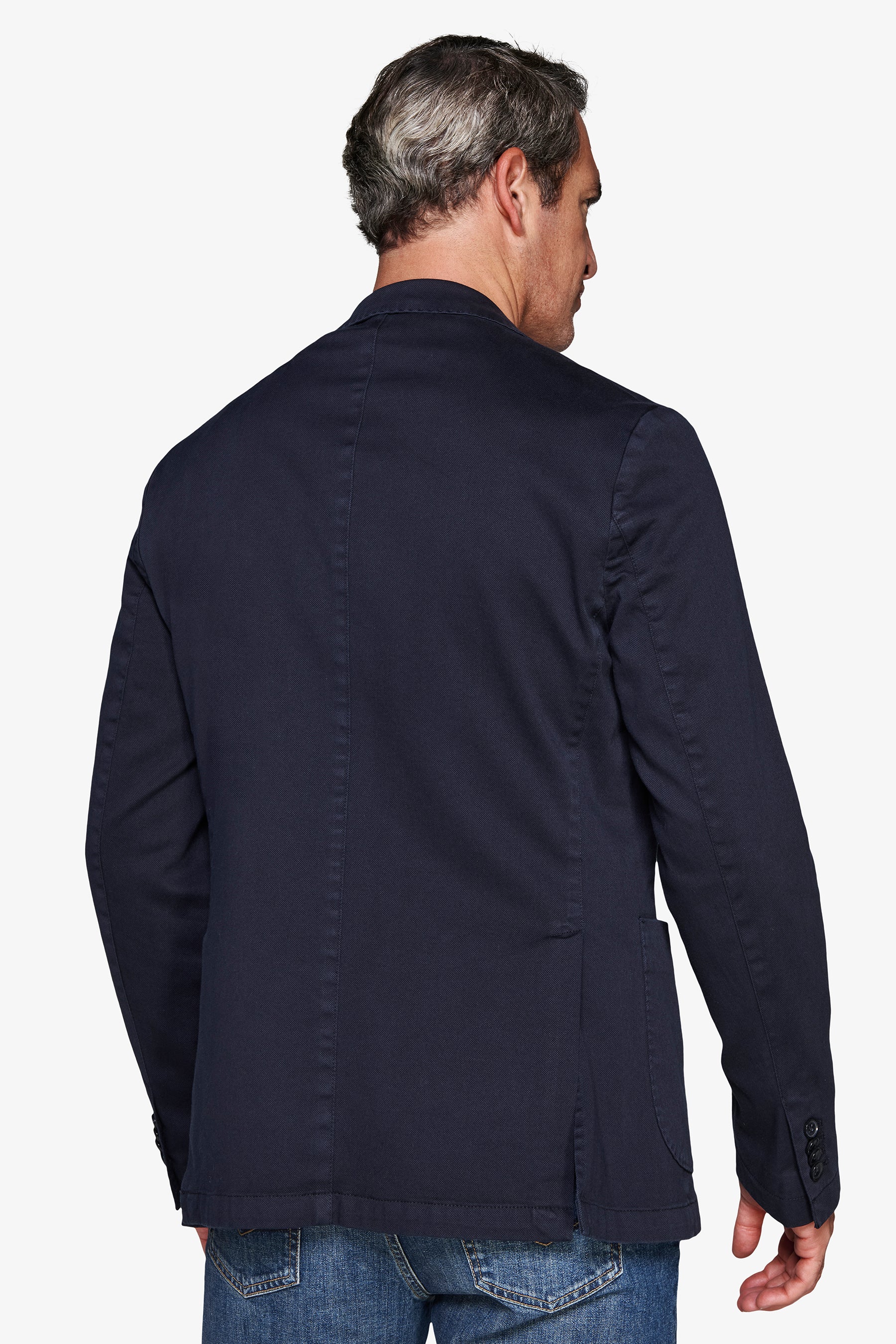Navy blazer, back view, with a center back seam, single vent, and three buttons on the right sleeve cuff.