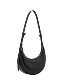 Black pebbled faux leather crescent crossbody bag with a layered design, gold-toned zipper, and adjustable strap.