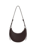Dark brown crescent-shaped crossbody bag with a woven texture, thin adjustable strap, and zipper closure.