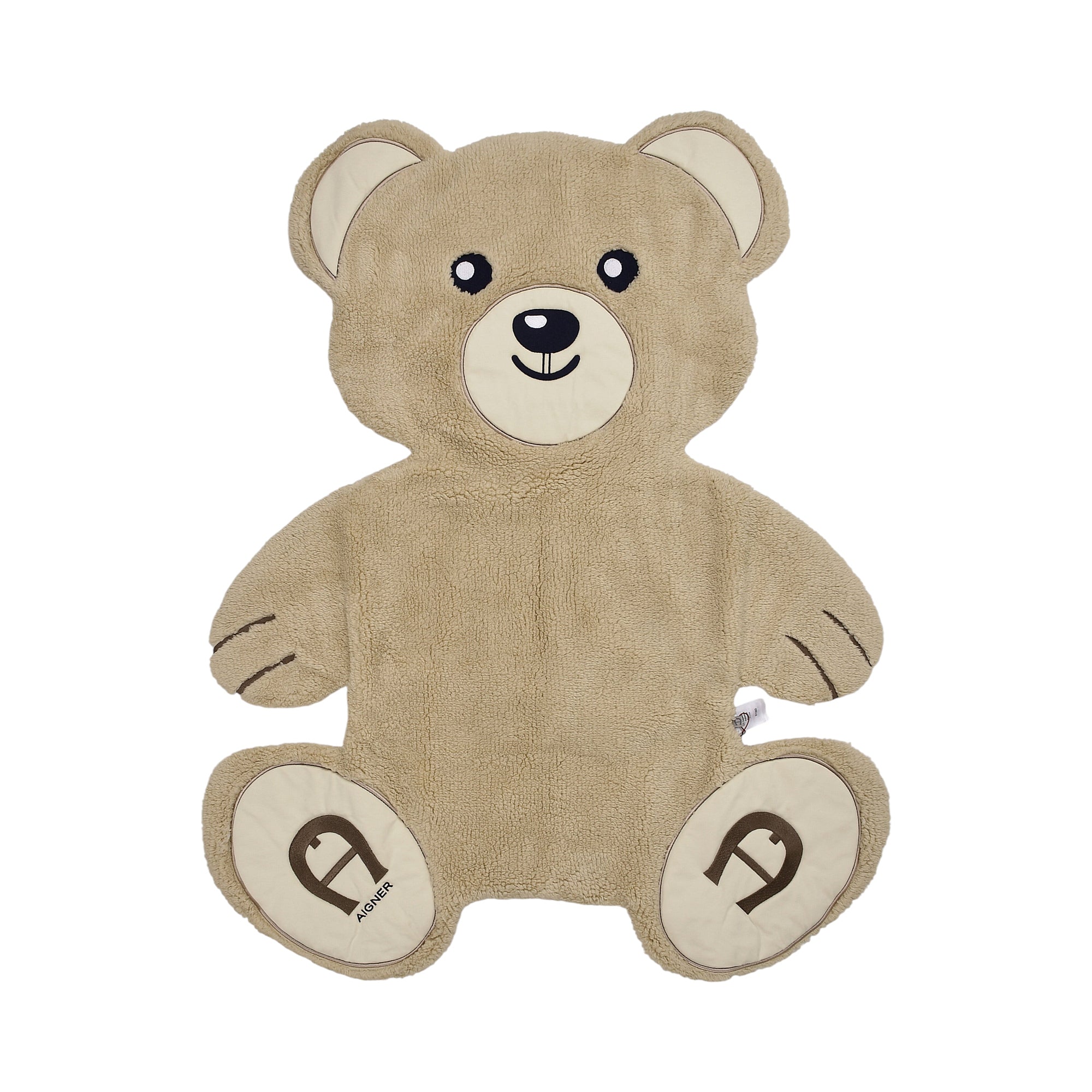 Brown teddy bear shaped plush blanket with embroidered face and Aigner logo on feet