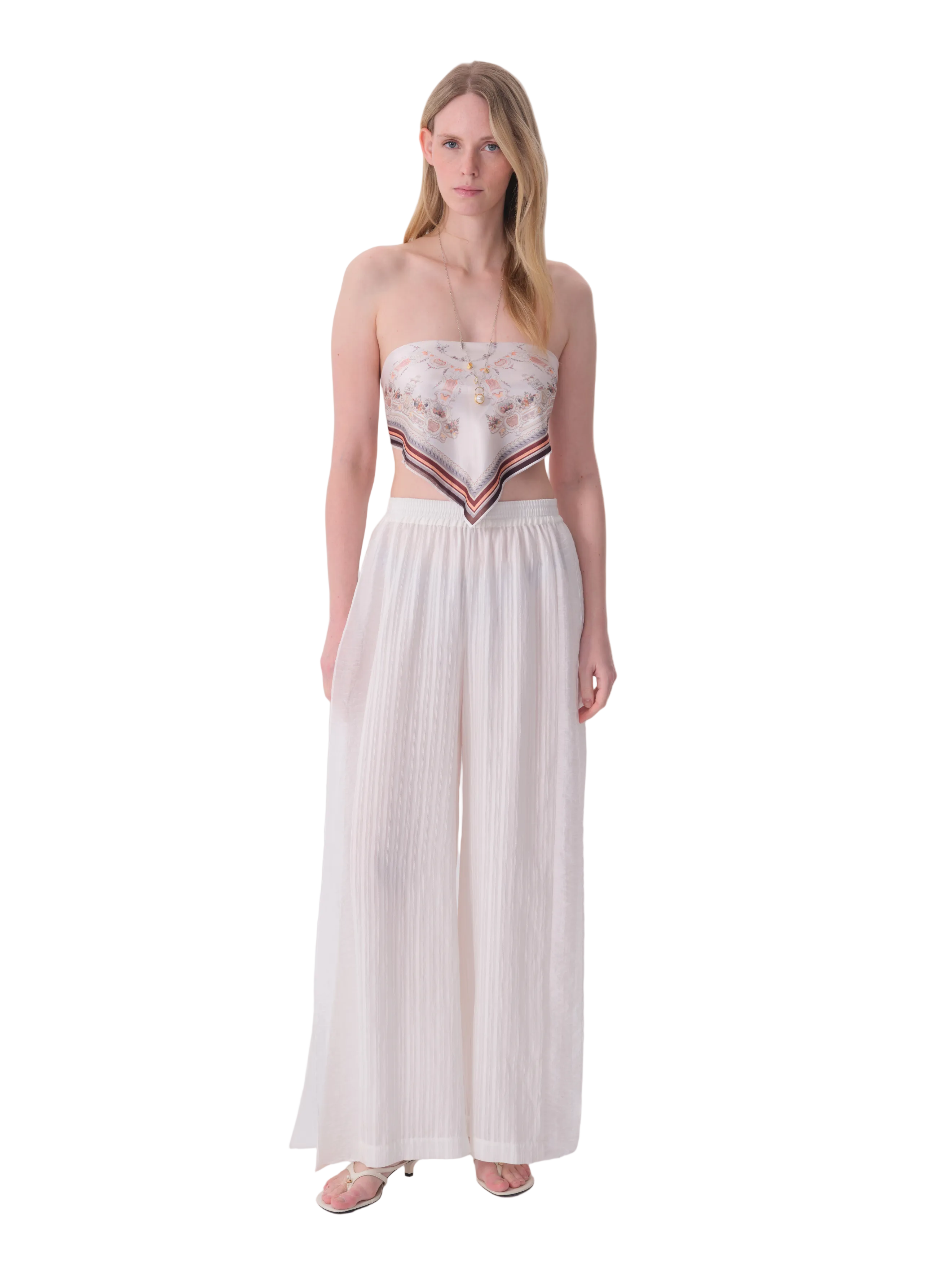 White wide-leg trousers with an elasticated waistband and subtle vertical textured fabric.