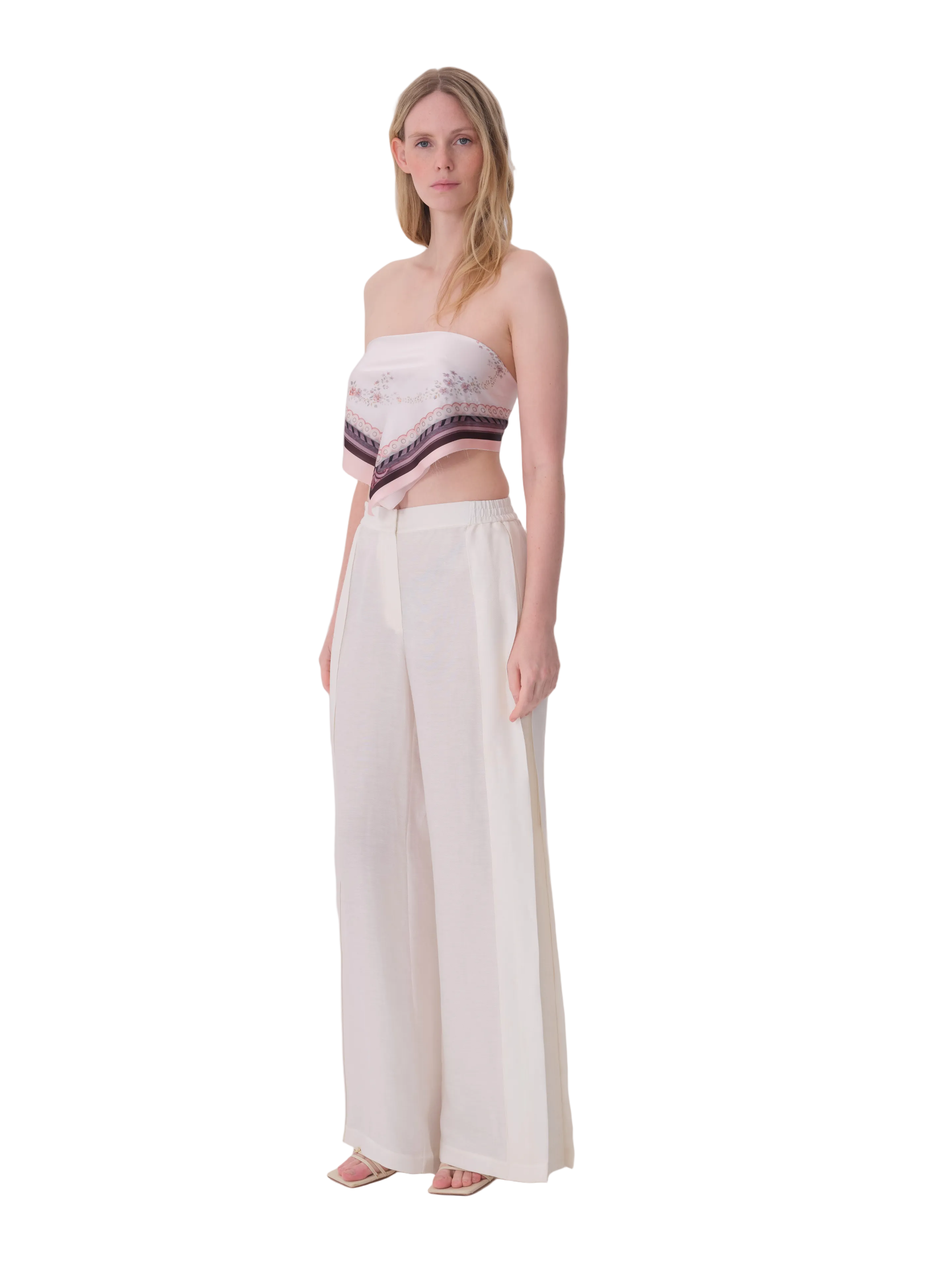 Ecru wide-leg trousers with a high, elasticated waist and subtle vertical side panels.
