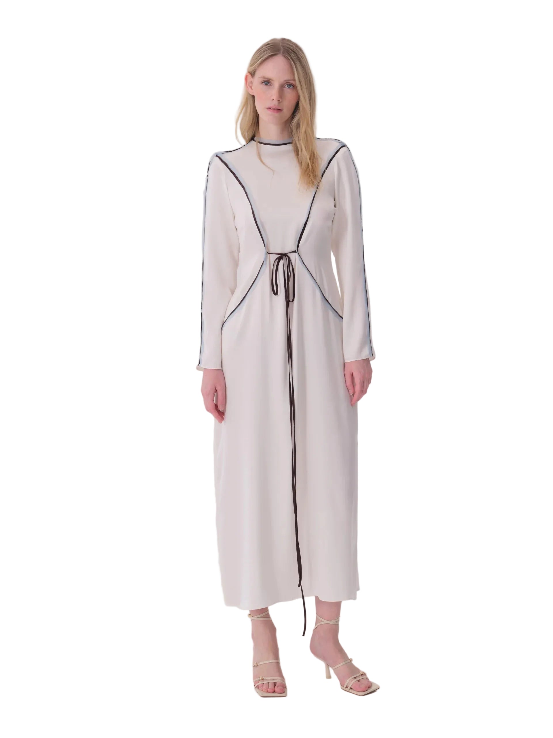 Ecru long sleeve midi dress with a high neck, dark contrasting piping, and a dark tie-waist detail.