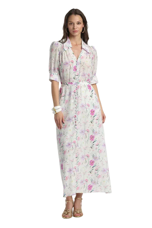Off-white maxi shirt dress with a fuchsia and purple floral print, collared V-neck, button-front, and short puffed sleeves.