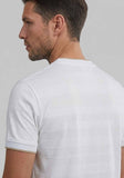 White t-shirt with horizontal textured stripes. Gold-toned trim on inner neck and ribbed sleeve cuffs. "KARL LAGERFELD" on ba