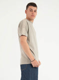 Khaki crewneck T-shirt with 'KARL LAGERFELD' text printed vertically in a lighter shade on the right shoulder.