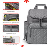 Grey quilted backpack with chevron pattern, multiple zippered pockets with grey pull tabs, top handle, and lime green interio