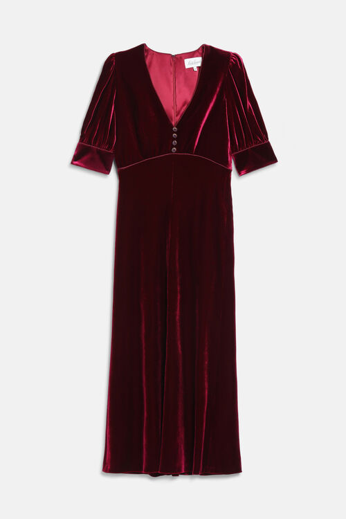 Ruby velvet maxi dress with a V-neck, short puffed sleeves, an empire waist, and four dark buttons on the bodice.