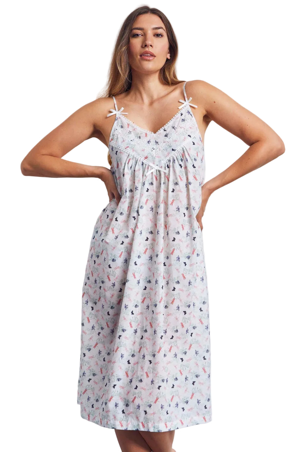 White voile nightdress with a multi-coloured butterfly and flora print, white lace trim, and spaghetti straps tied into bows.