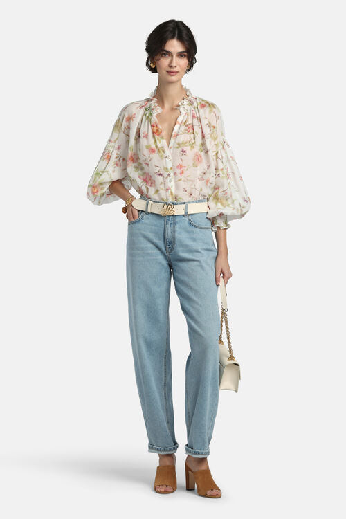 Off-white floral shirt with peach/pink flowers, ruffled collar, V-neck, button front, and voluminous long sleeves with gather